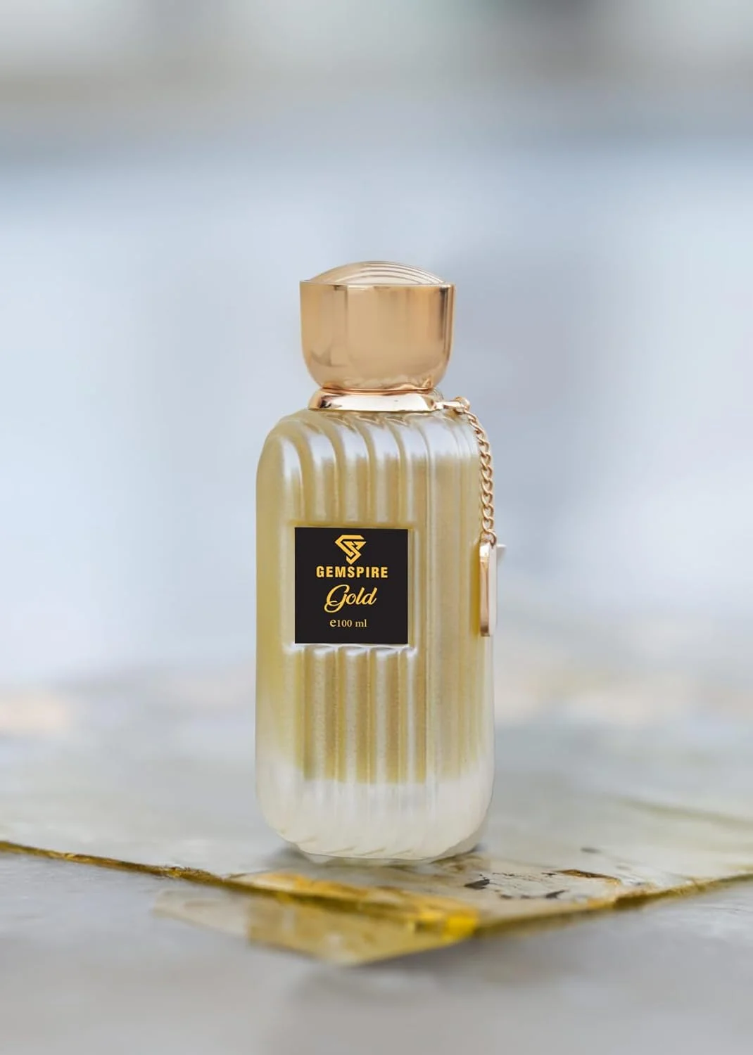 ادو پرفیوم طلایی – رایحه کهربایی گلی مناسب آقایان و بانوان، ماندگاری بالا، بر پایه روغن، 100 میلی لیتر، عطر لوکس