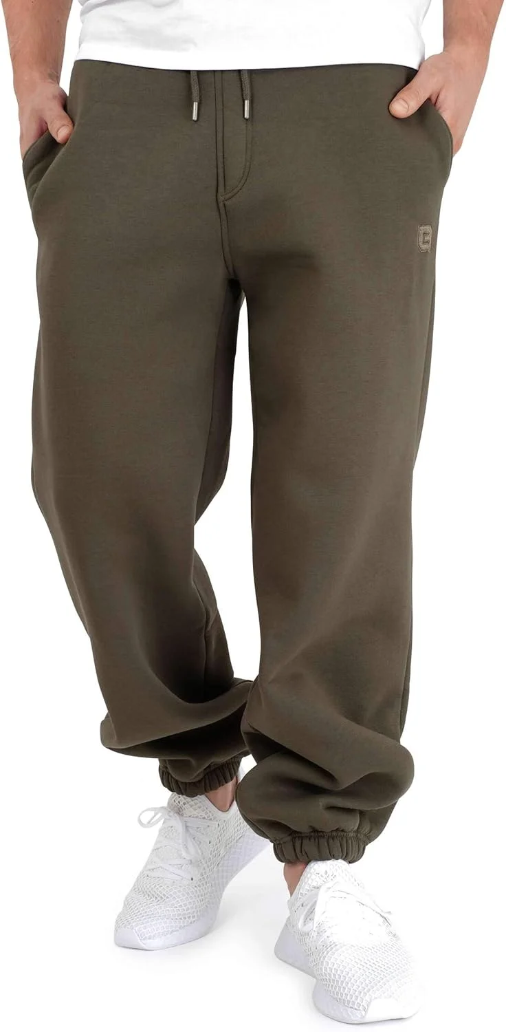 شلوار جاگر مردانه و زنانه زیتونی تیره | شلوار گرم و نرم اسپرت یونیسکس با برش گشاد با 70% پنبه | شلوار راحتی بغل جیب دار