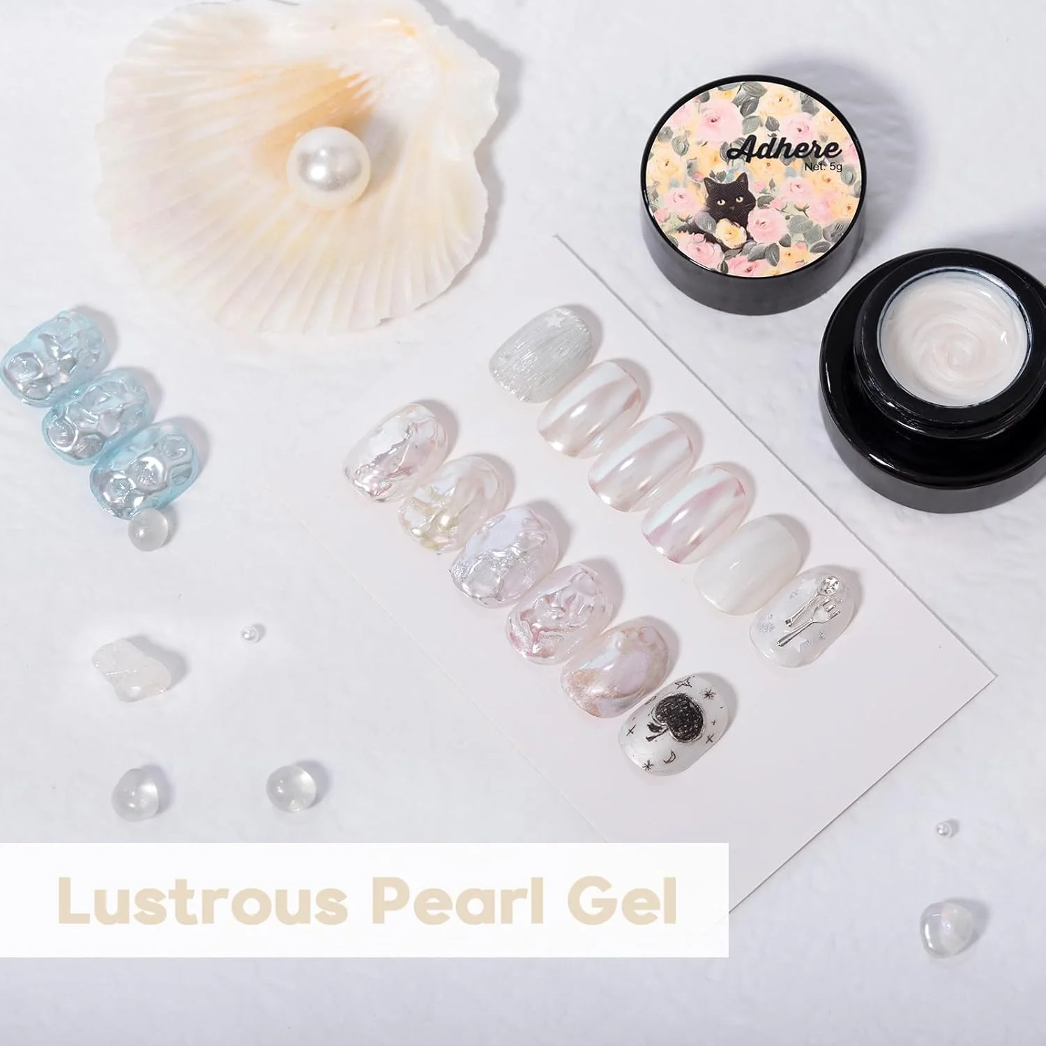 مجموعه ۷ عددی سری مروارید ADHERE، ۲ عدد ژل مرواریدی ۱۲ میلی لیتری + ۳ پودر کروم + ۱ پودر کروم آینه ای بنفش تیره + ۱ اکلیل، درخشش هولوگرافیک و روکش مرواریدی و درخشش متالیک آینه ای