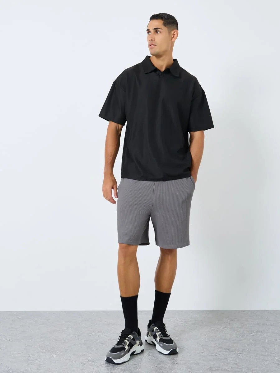 پولوشرت مردانه استایلی با بافت طرح‌دار و مدل آزاد با یقه باز