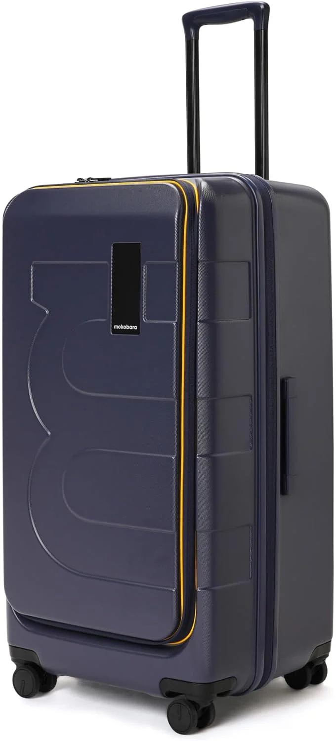 چمدان بزرگ مسافرتی مدل Em Access Trunk از MOKOBARA، سایز 79.2 سانتی متر | چمدان سخت بدنه پلی کربنات قابل افزایش حجم با 8 چرخ گردان و قفل TSA - طرح We Meet Again Sunray (آبی و زرد)