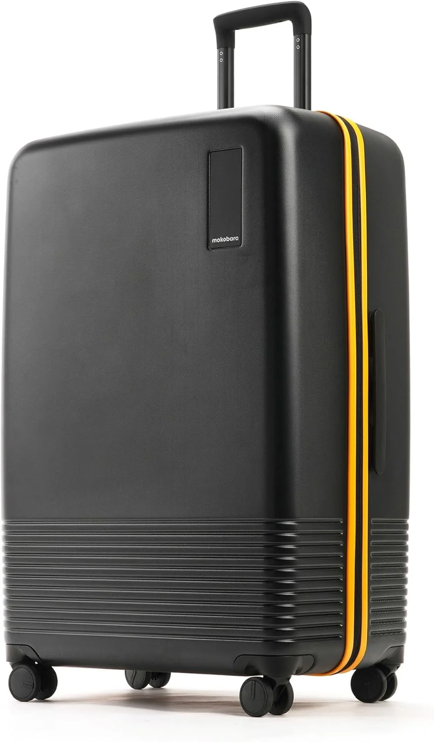 چمدان سایز بزرگ 79 سانتی‌متری موکوبارا از جنس پلی‌کربنات ماکرولون آلمان با 8 چرخ هینوموتو - طرح مانی مووز سانری (مشکی و زرد)