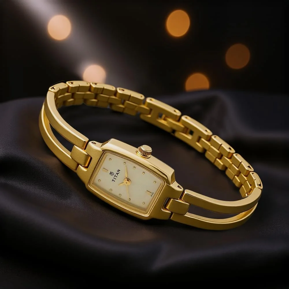 ساعت مچی آنالوگ زنانه تایتان کارিশما با صفحه طلایی - NL2131YM04/NP2131YM04