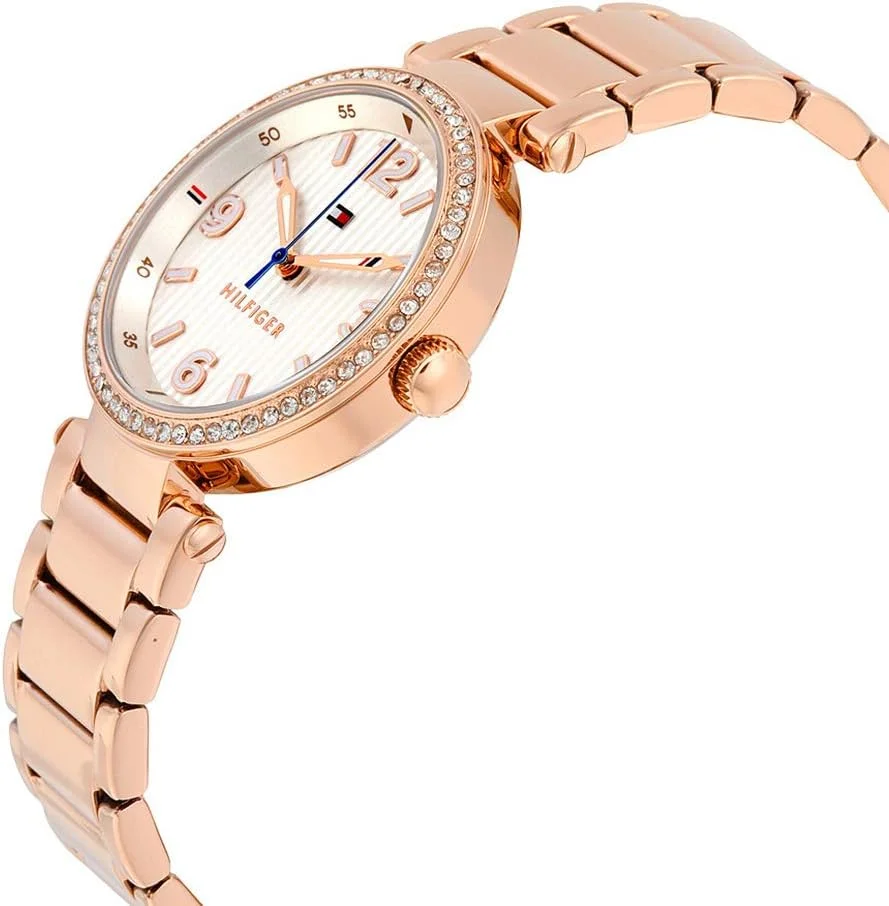 ساعت مچی زنانه تامی هیلفیگر مدل LYNN با صفحه نقره ای و سفید، بدنه استیل با روکش رزگلد و نگین ساعت مچی زنانه تامی هیلفیگر مدل LYNN با صفحه نقره ای و سفید، بدنه استیل با روکش رزگلد و نگین