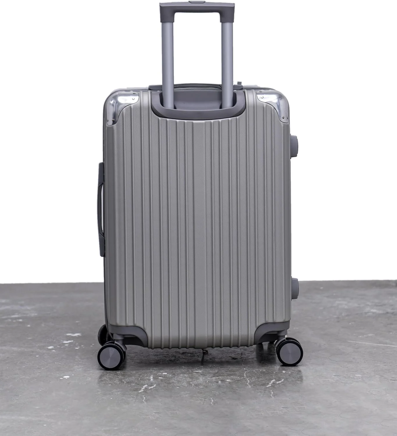 چمدان چرخشی بدنه سخت - سایز 24 اینچ (63 سانتی‌متر)، جنس: ABS، نقره‌ای