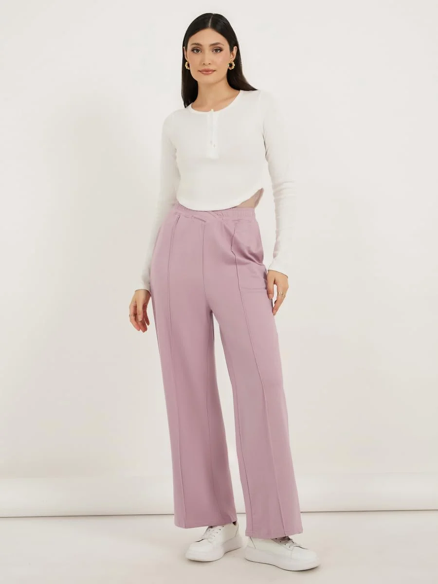 شلوار جاگر زنانه استایلی با کمر ضربدری و جزئیات پین‌تاک