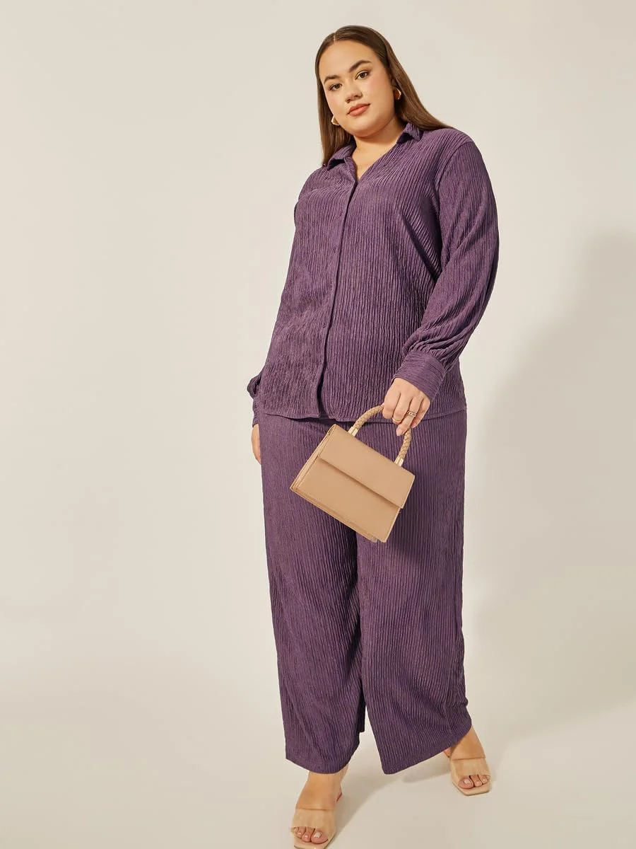 شلوار زنانه سایز بزرگ استایلی، بافت‌دار، فاق متوسط و پاچه گشاد