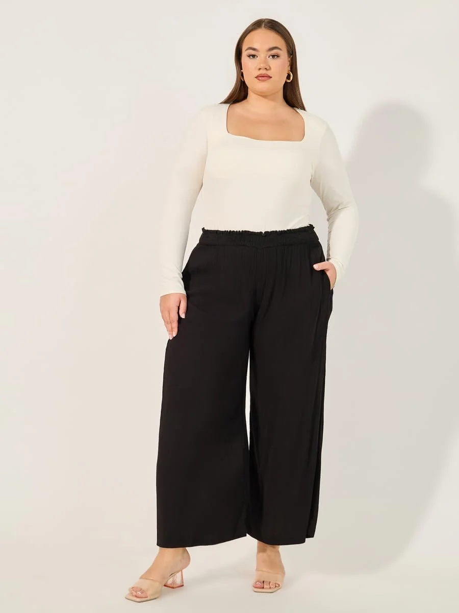 شلوار زنانه استایلی سایز بزرگ، طرح ساده، چروک، پاچه گشاد و قد تا مچ پا