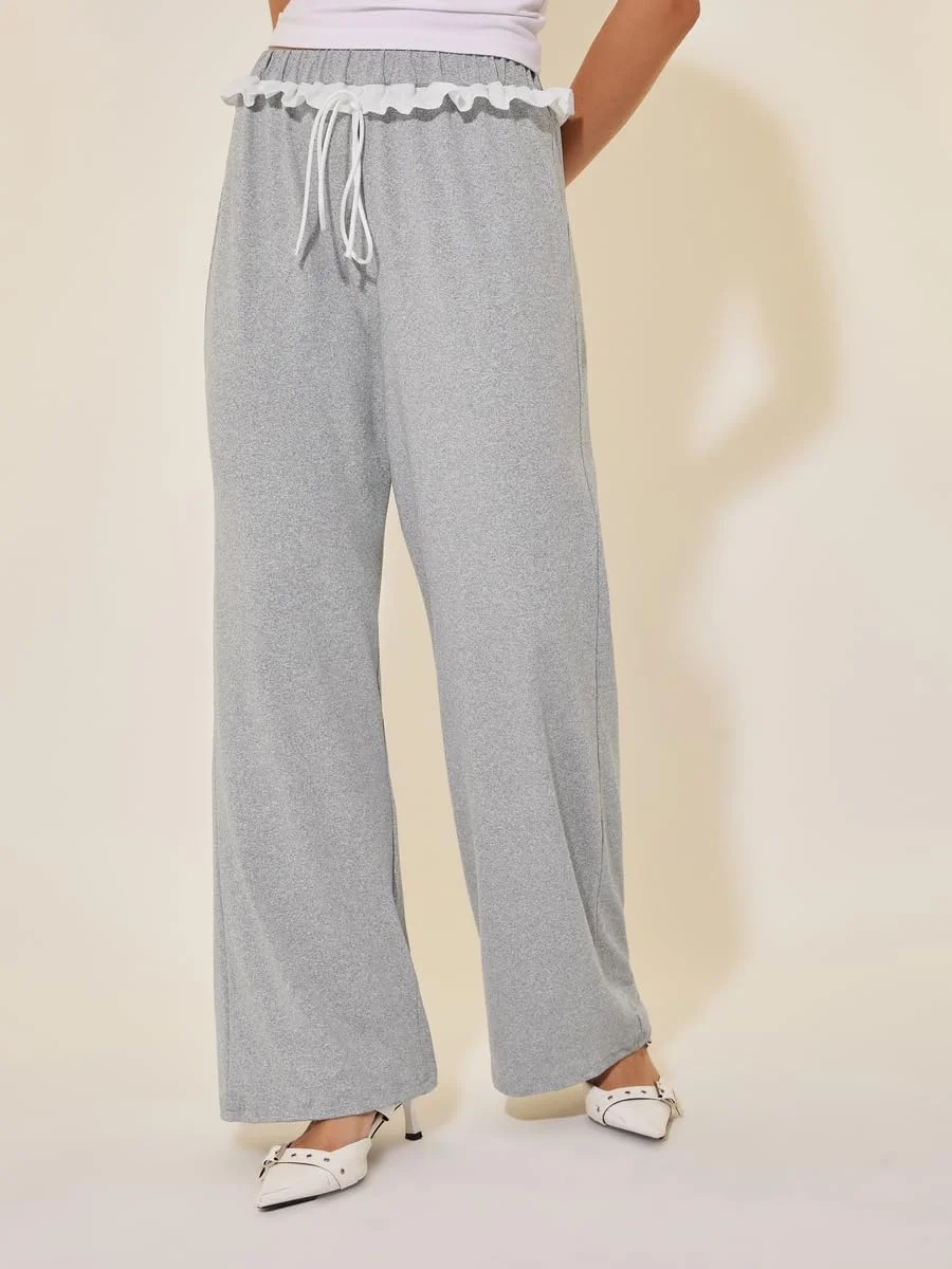 شلوار زنانه استایلی، طرح ساده، مدل آزاد، دارای جزئیات گیپور و بند