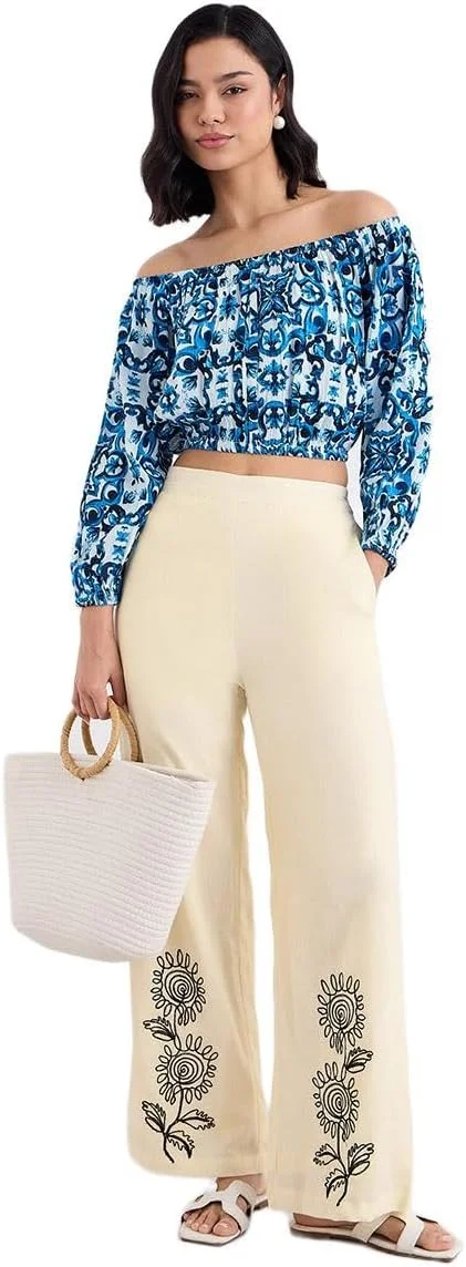 شلوار زنانه استایلی کرم رنگ با پاچه گشاد و جزئیات گلدوزی