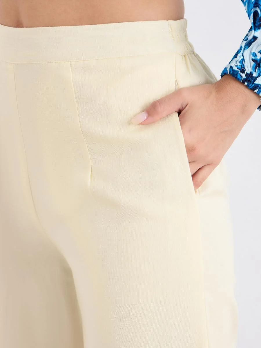 شلوار زنانه استایلی کرم رنگ با پاچه گشاد و جزئیات گلدوزی