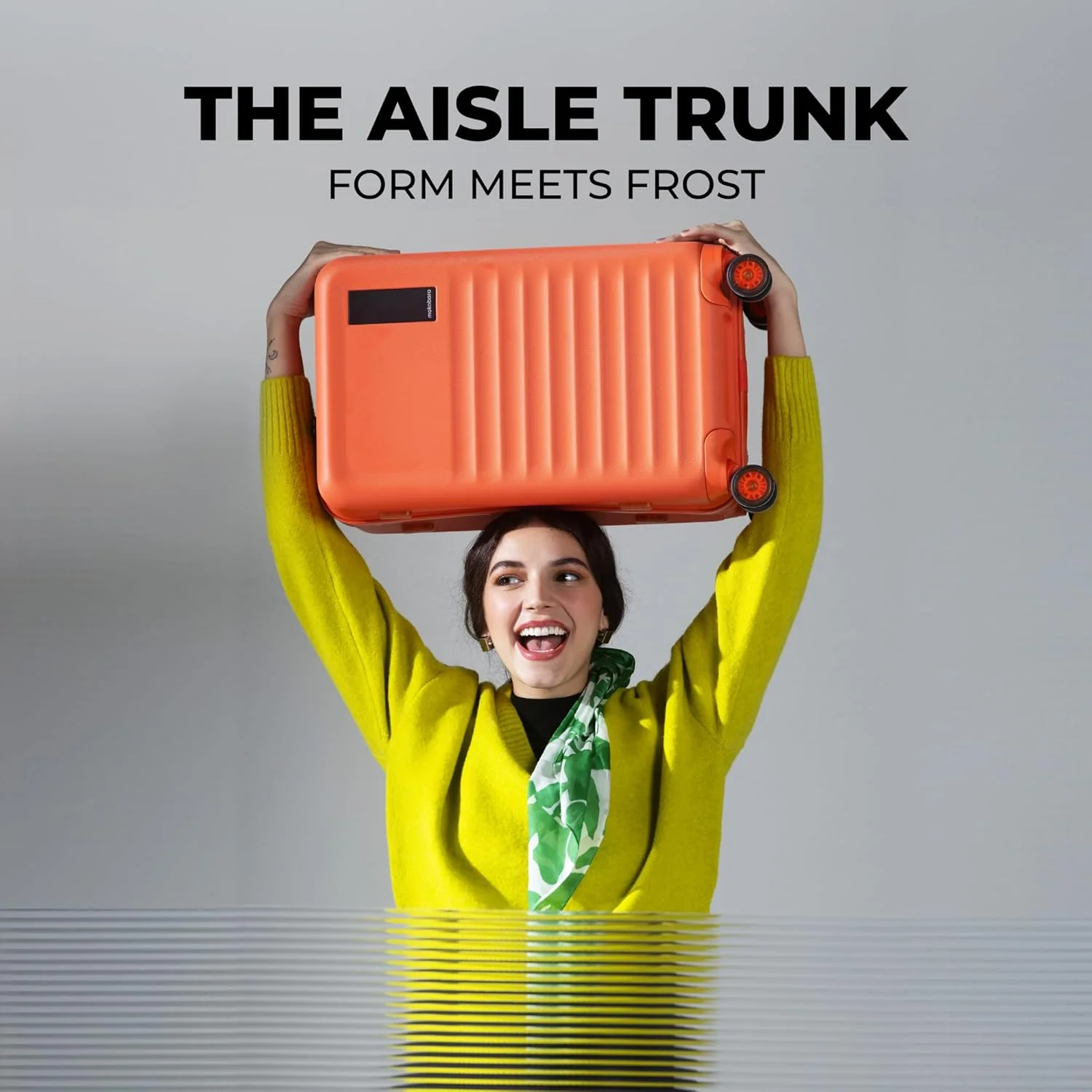 چمدان کابین Mokobara The Aisle Trunk | بدنه پلی کربنات 56 سانتی‌متری، زیپ‌های YKK، قفل مورد تایید TSA و چرخ‌های نینجا بی‌صدا (کابین، استارداست) نارنجی