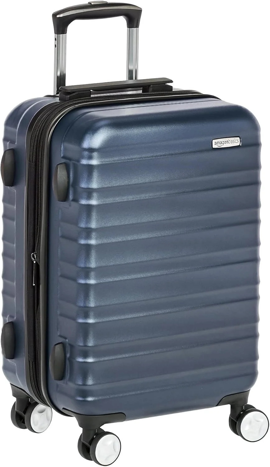 چمدان چرخ‌دار سخت آمازون بیسیکس با قفل - سایز کابین ۲۱ اینچ (۵۳ سانتی‌متر)، جنس: پلی‌کربنات، سرمه‌ای