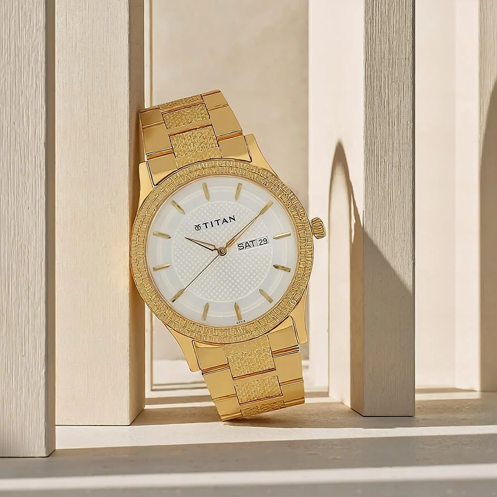 ساعت مچی مردانه تیتان آنالوگ با صفحه نقره ای و بند طلایی استیل - NL1650YM05/NL1650YM05