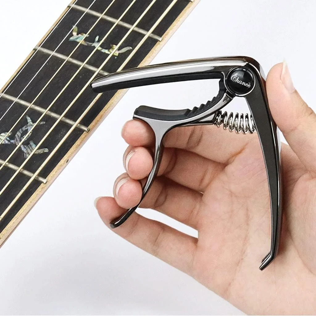 گیره تعویض سیم گیتار آکوستیک فولک ZXM، مناسب برای گیتار الکتریک و کلاسیک، چند منظوره (رنگ: مشکی) گیره تعویض سیم گیتار آکوستیک فولک ZXM، مناسب برای گیتار الکتریک و کلاسیک، چند منظوره (رنگ: مشکی)