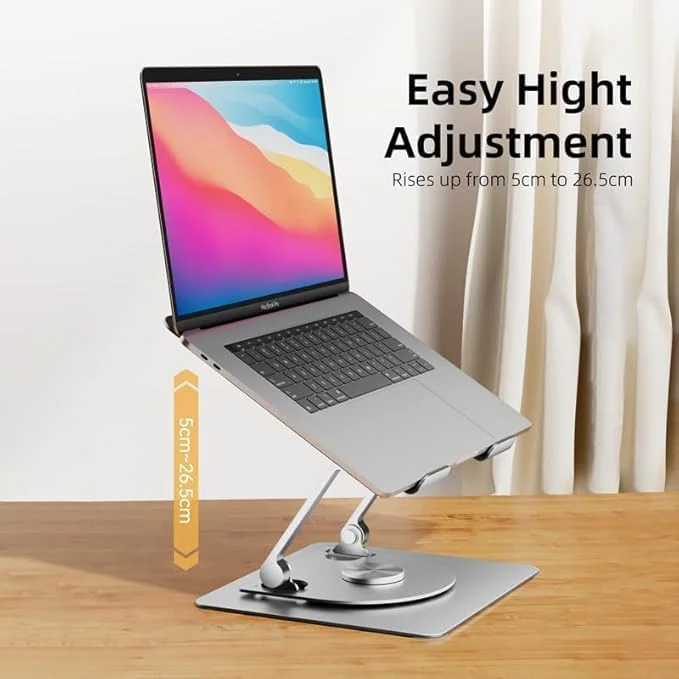 پایه لپ تاپ چرخان 360 درجه: ایده آل برای تجربه دید بهتر ● طراحی ارگونومیک: صفحه نمایش را برای زاویه دید بهتر به سطح چشم بالا می برد ● تهویه مناسب: طراحی باز گردش هوا را افزایش می دهد - مناسب برای کار