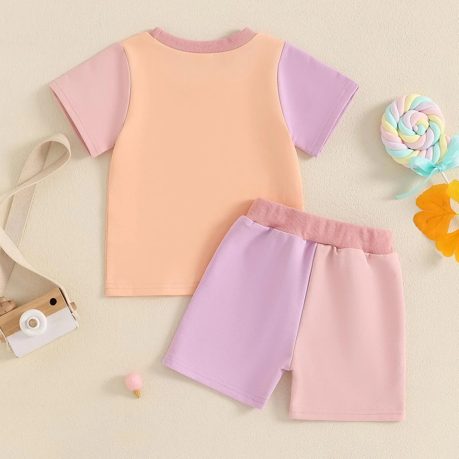 ست لباس تابستانی دخترانه شامل تیشرت آستین کوتاه طرح دار و شلوارک کشی