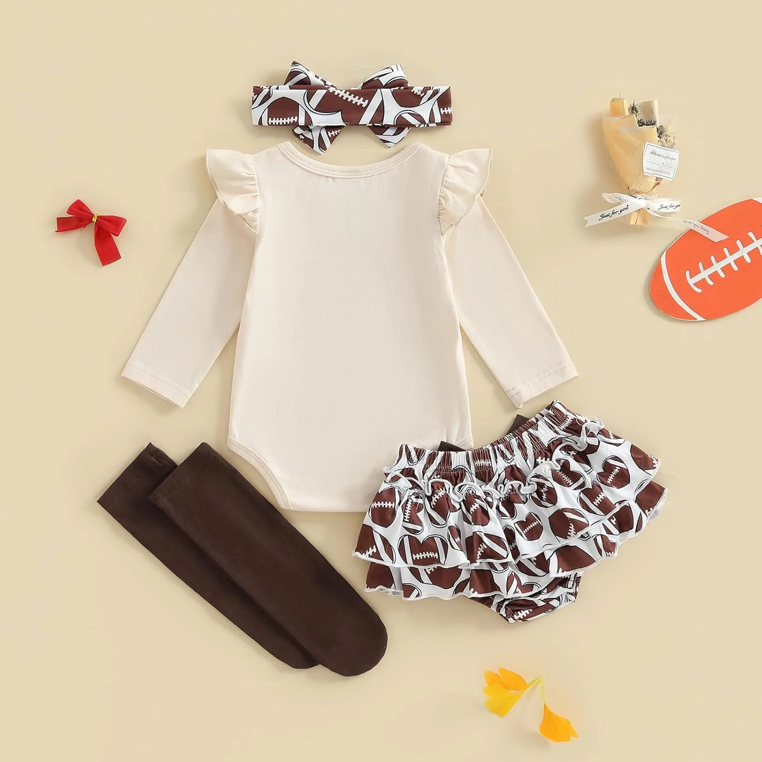 لباس نوزاد دخترانه فوتبالی، سرهمی آستین بلند با چاپ حروف، شورت چین دار، هدبند و جوراب ساق بلند، ست 4 تکه لباس روز بازی