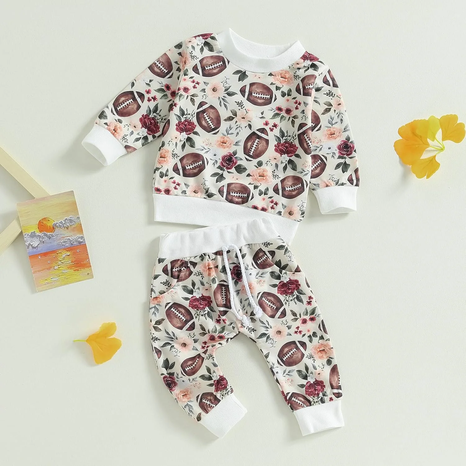 لباس نوزادی دخترانه طرح گل، شامل بلوز آستین بلند و شلوار، مناسب فصل پاییز و زمستان