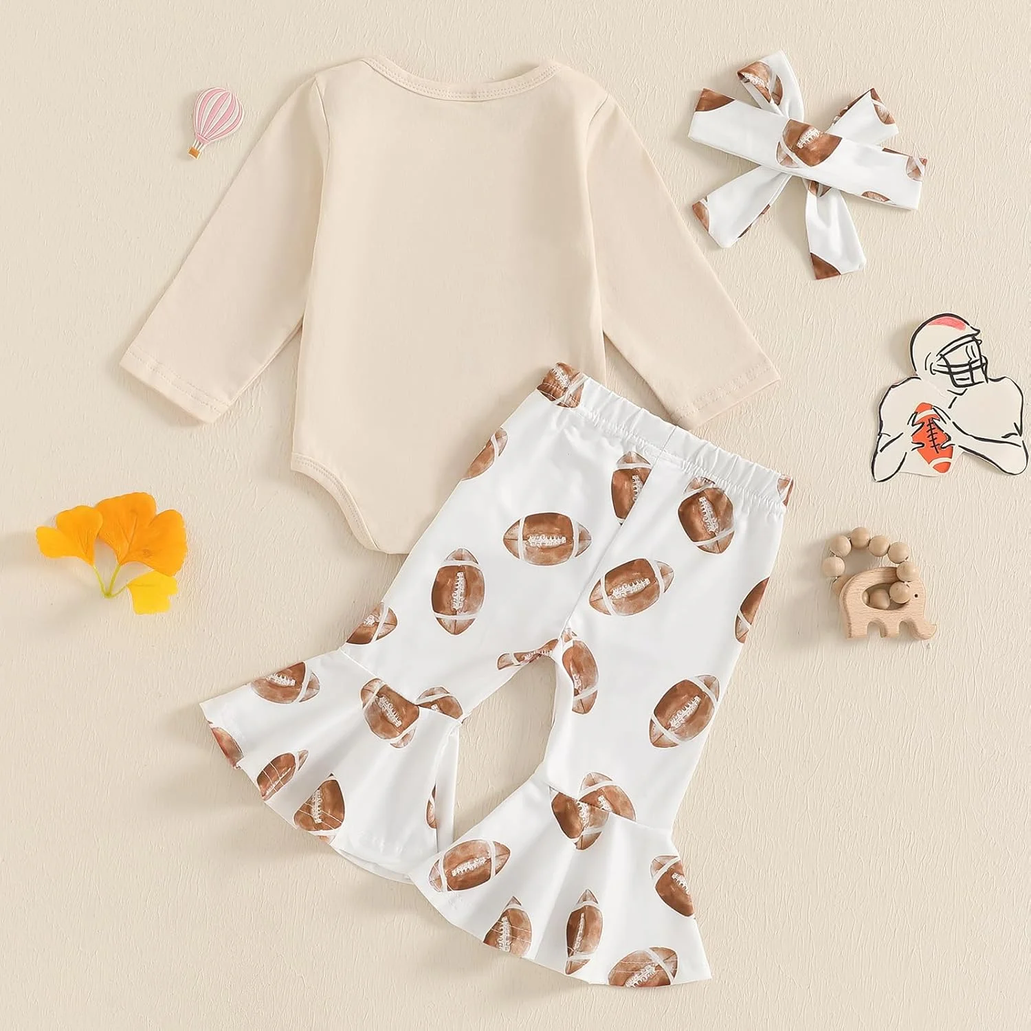 ست لباس نوزاد دخترانه شامل سرهمی آستین بلند با طرح حروف، شلوار دمپا گشاد طرح توپ و هدبند