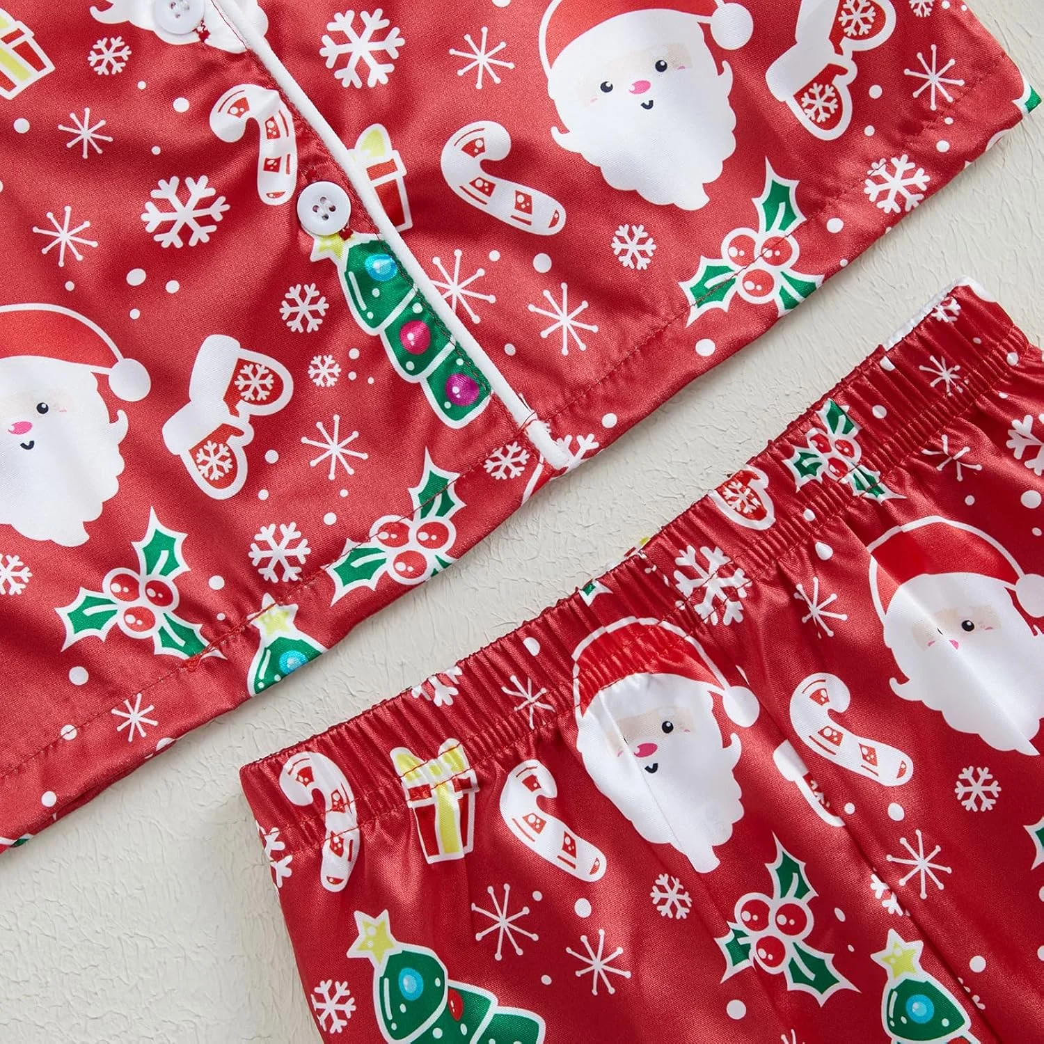 پیژامه ساتن ابریشمی کریسمس دخترانه و پسرانه بچه گانه، بلوز آستین بلند و شلوار طرح کریسمس