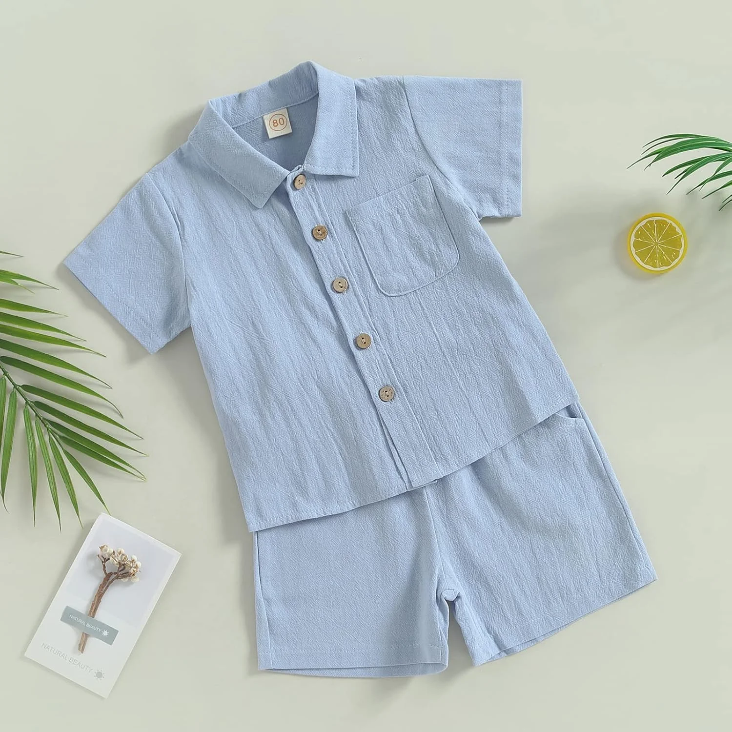 ست لباس تابستانی پسرانه شامل پیراهن آستین کوتاه یقه برگردان دکمه دار و شلوارک