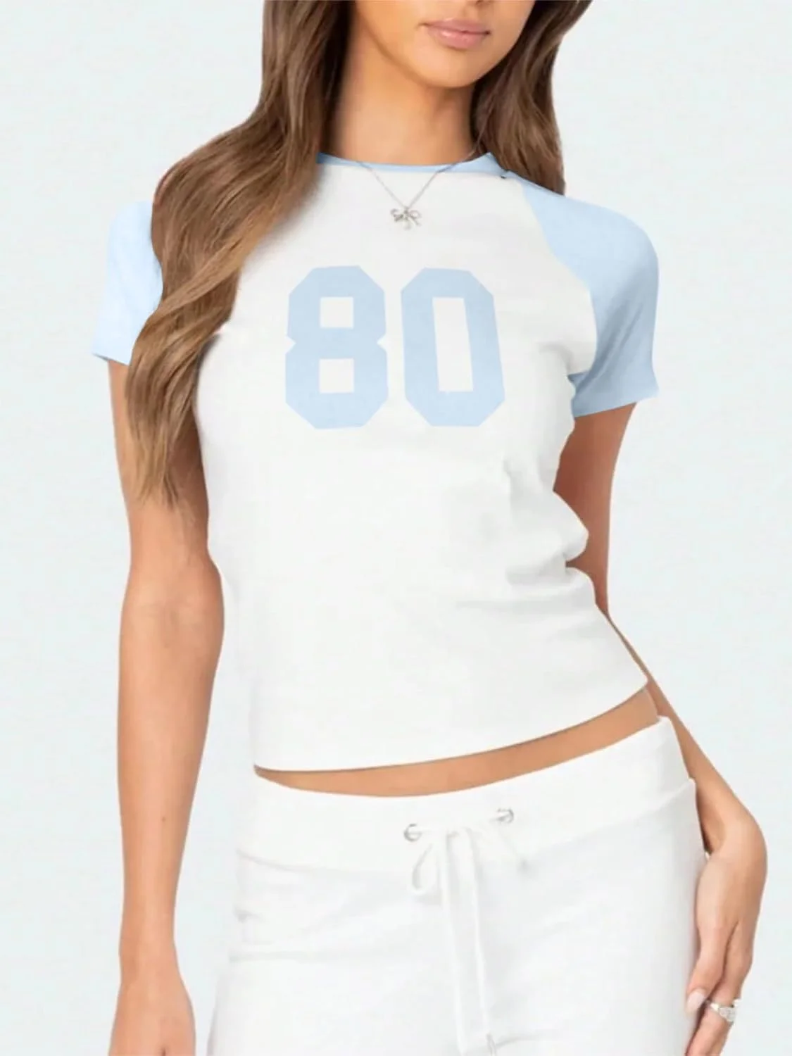 تیشرت نیمتنه آستین کوتاه زنانه با طرح گرافیکی دهه 80، یقه گرد، مناسب فصل تابستان تیشرت نیمتنه آستین کوتاه زنانه با طرح گرافیکی دهه 80، یقه گرد، مناسب فصل تابستان