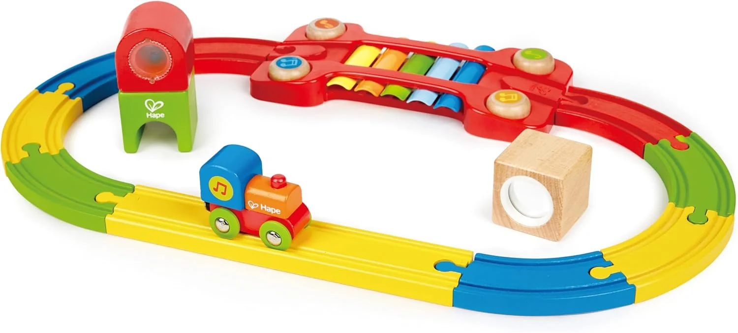 مدار راهآهن حسی Hape | مجموعه قطار چوبی رنگارنگ با لوازم جانبی، اسباب بازی قطار موزیکال کودکانه با زیلوفون داخلی، جغجغه و بلوک آینه ای، چند رنگ مدار راهآهن حسی Hape | مجموعه قطار چوبی رنگارنگ با لوازم جانبی، اسباب بازی قطار موزیکال کودکانه با زیلوفون داخلی، جغجغه و بلوک آینه ای، چند رنگ