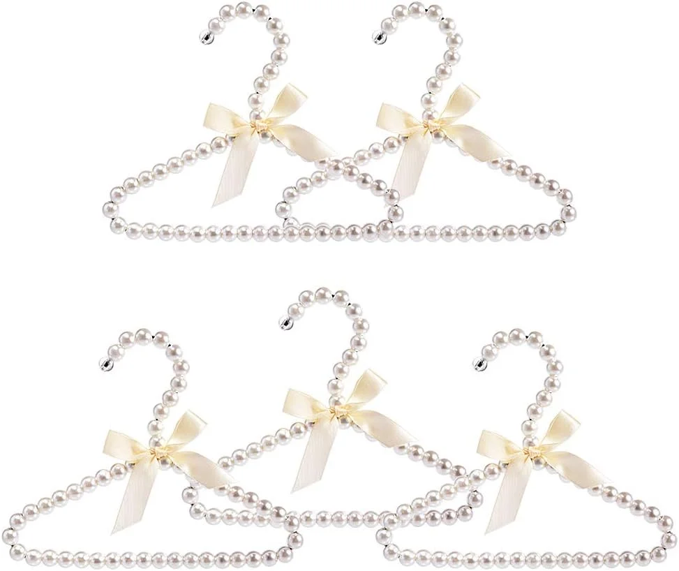 چوب لباسی لباس Koicaxy، چوب لباسی لباس پاپیونی مرواریدی مصنوعی سفید با قلاب برای کودکان، نوزادان، دختران و پسران، 5 عددی