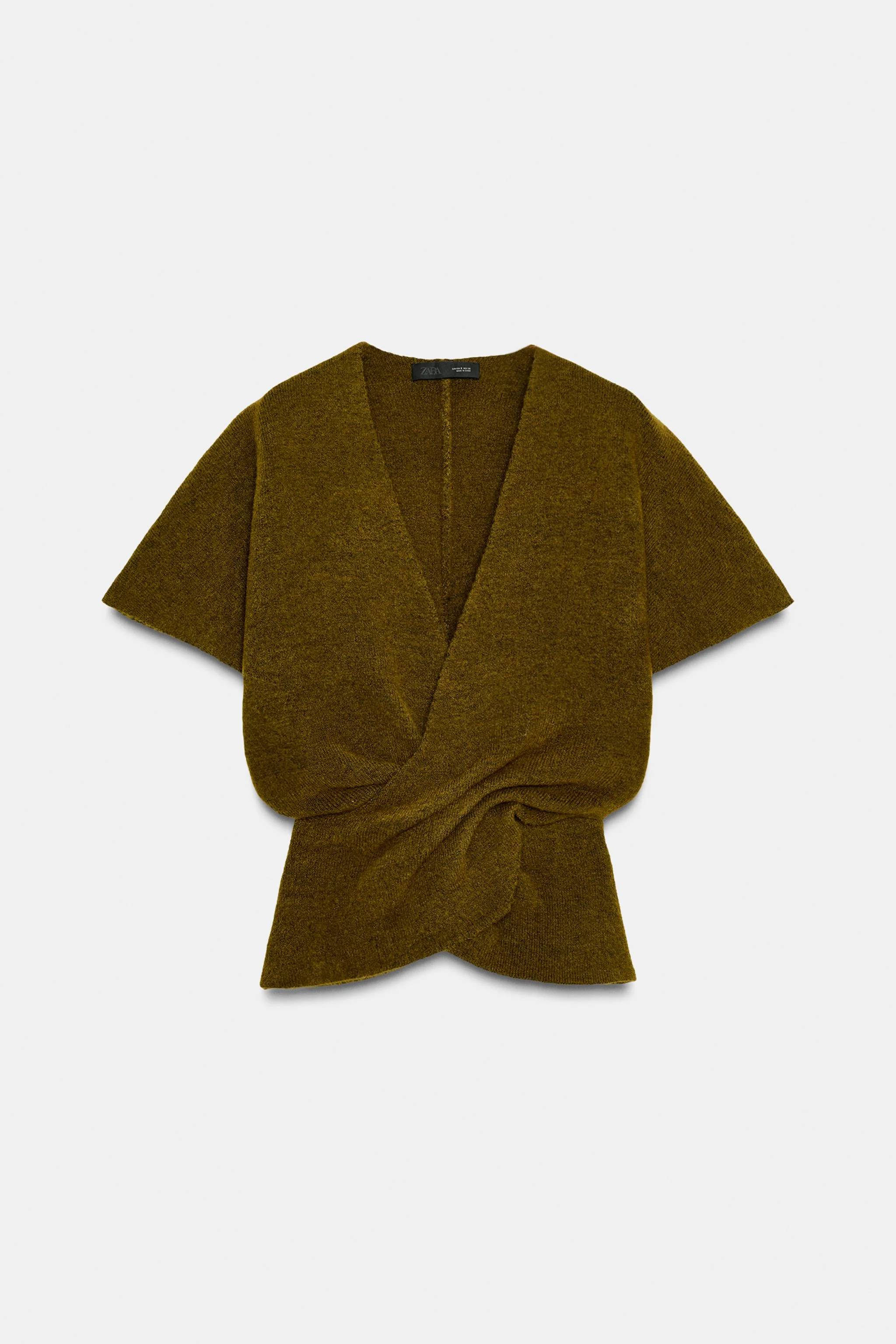 بلوز بافت آستین کوتاه یقه هفت با جزئیات چین دار در قسمت کمر بلوز بافت آستین کوتاه یقه هفت با جزئیات چین دار در قسمت کمر