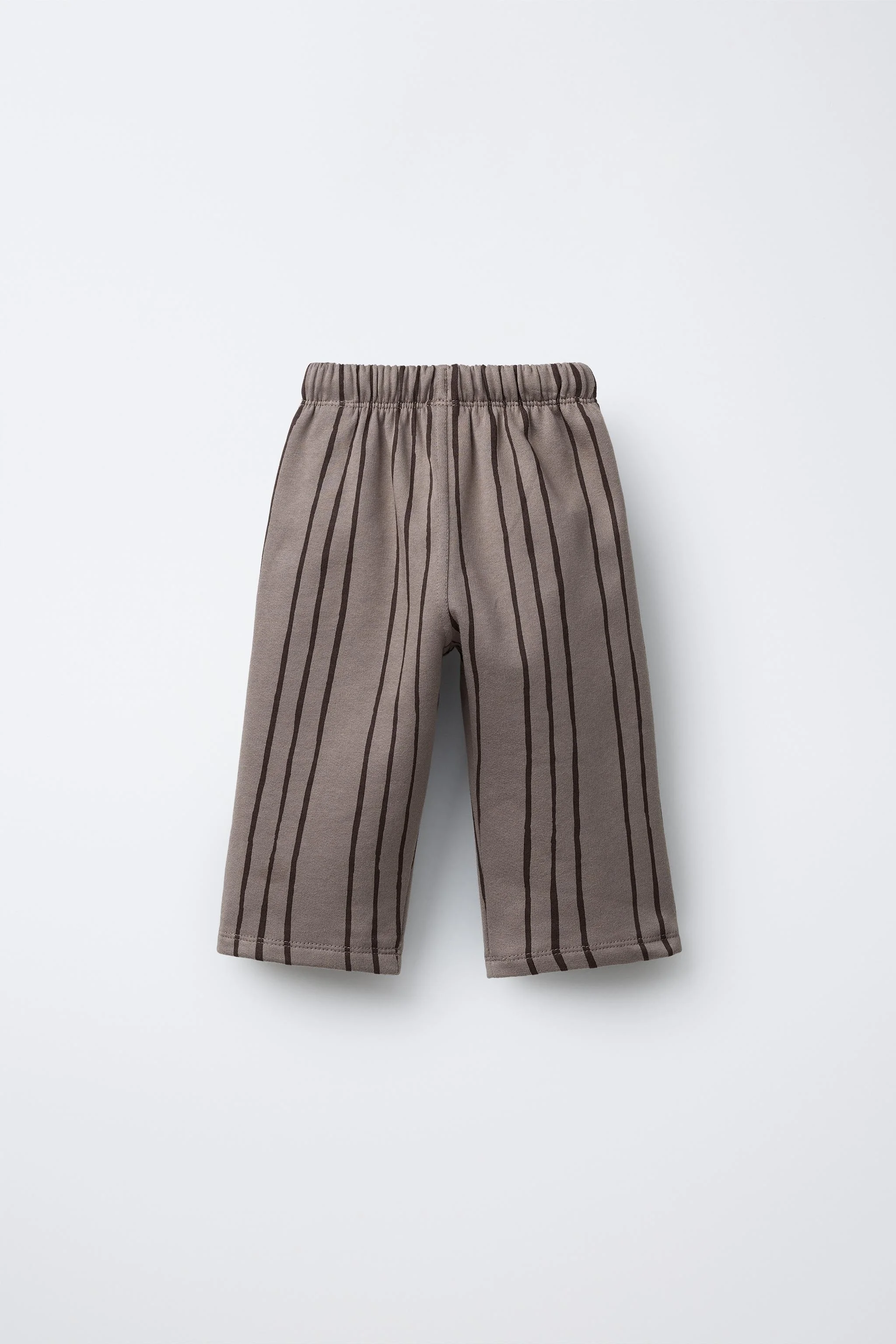 شلوار راه راه با تکه دوزی برچسب