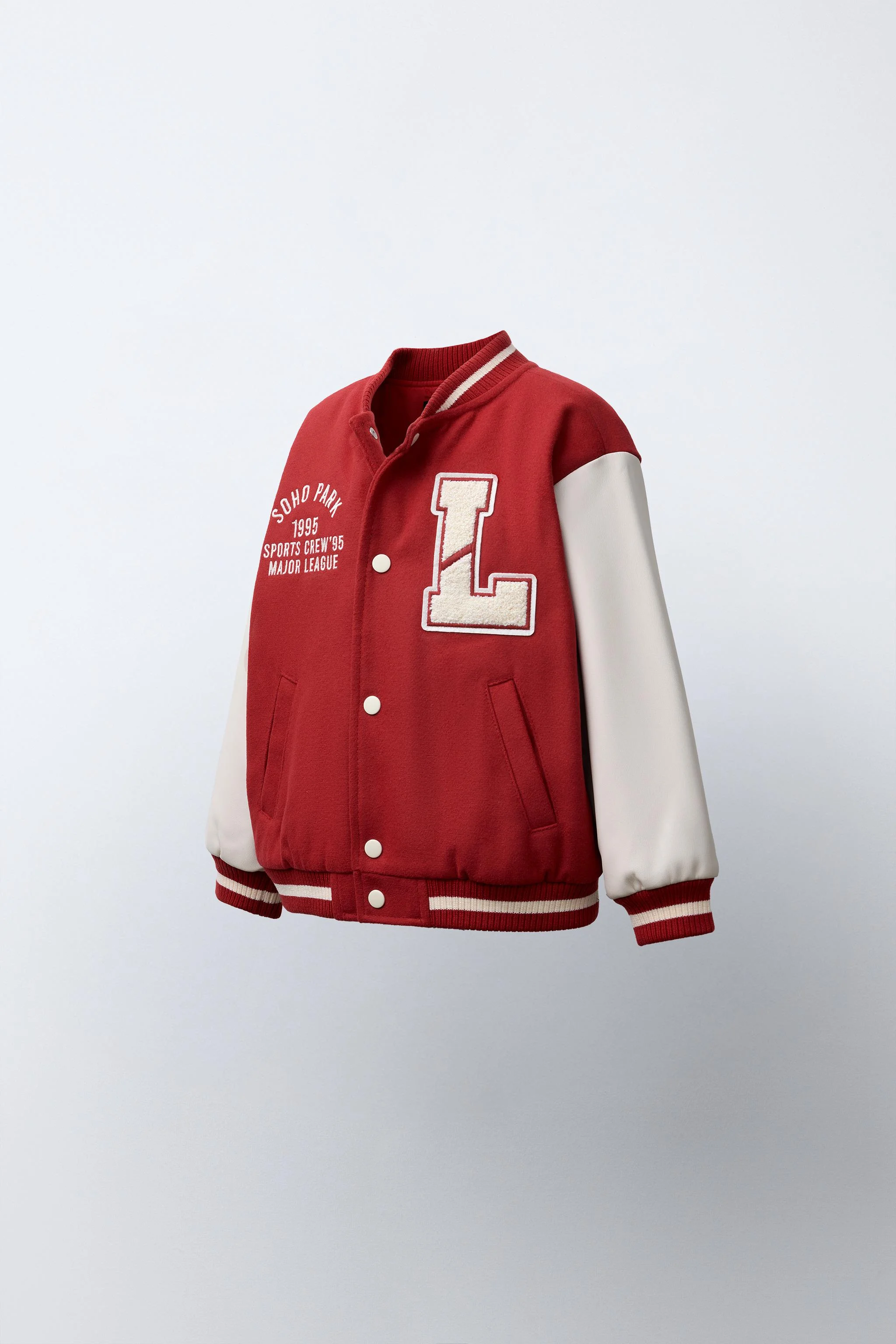 کاپشن خلبانی با آستین های چرم مصنوعی و تکه دوزی