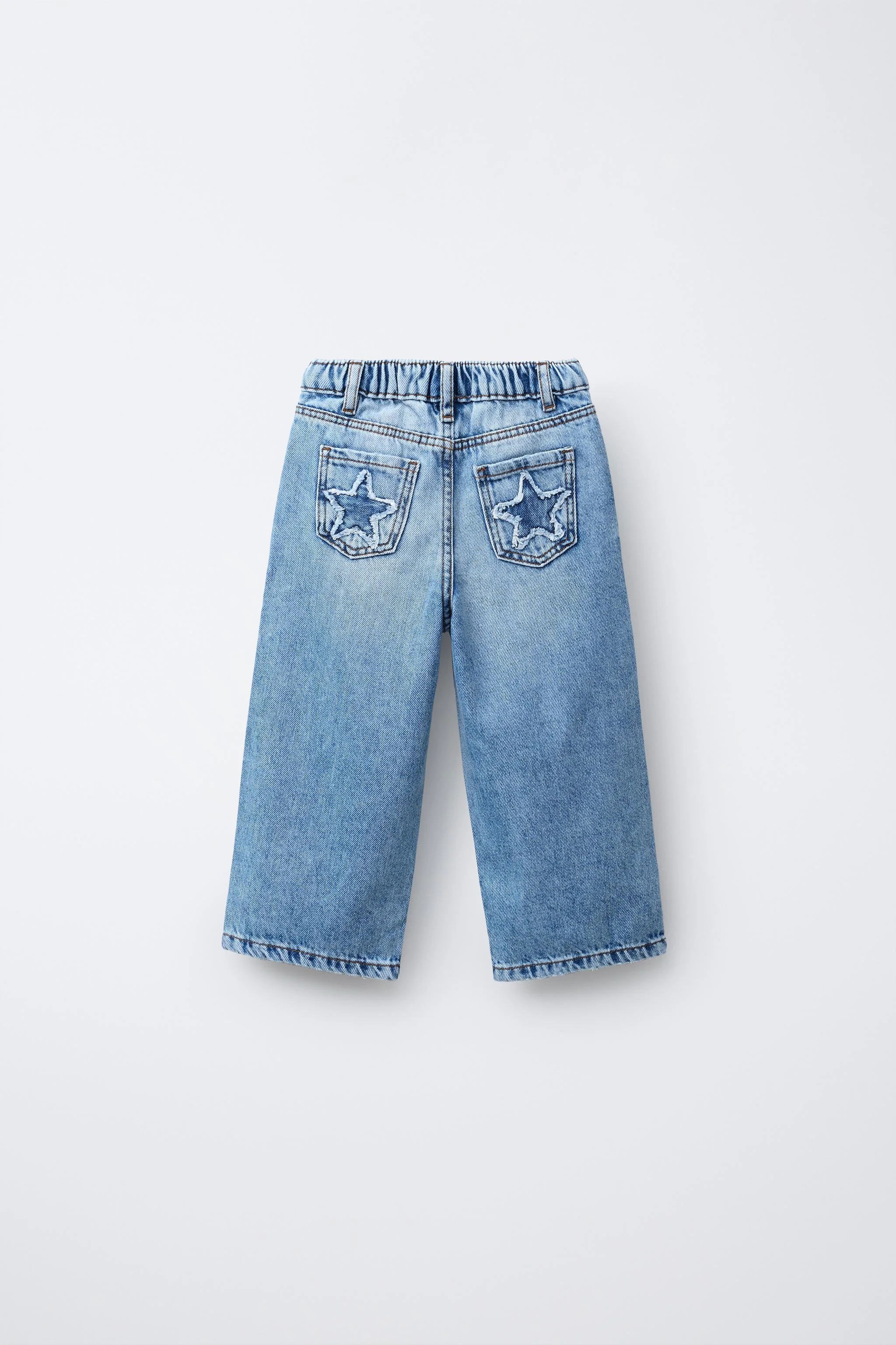 شلوار جین پاچه گشاد با جیب های ستاره دار شلوار جین پاچه گشاد با جیب های ستاره دار