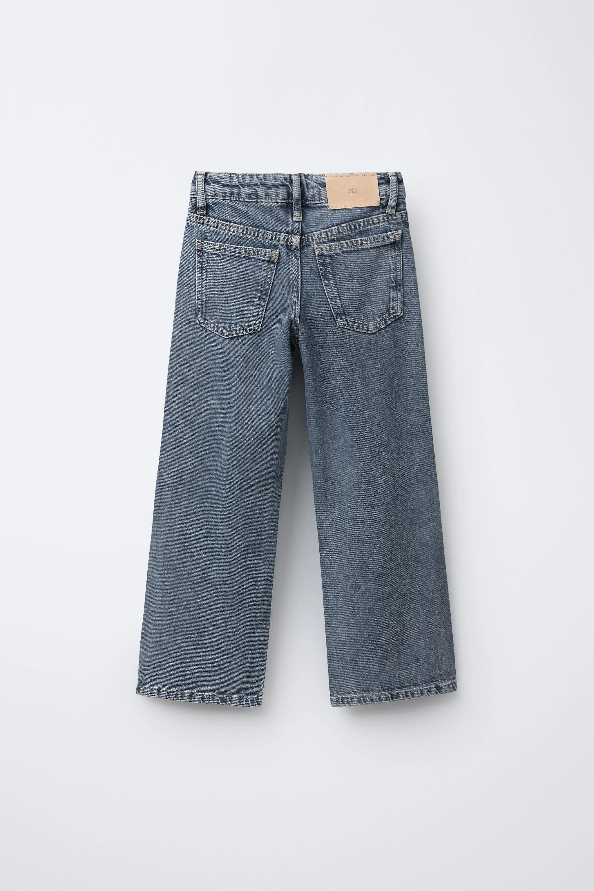 شلوار جین پاچه گشاد با تزئینات پرچ