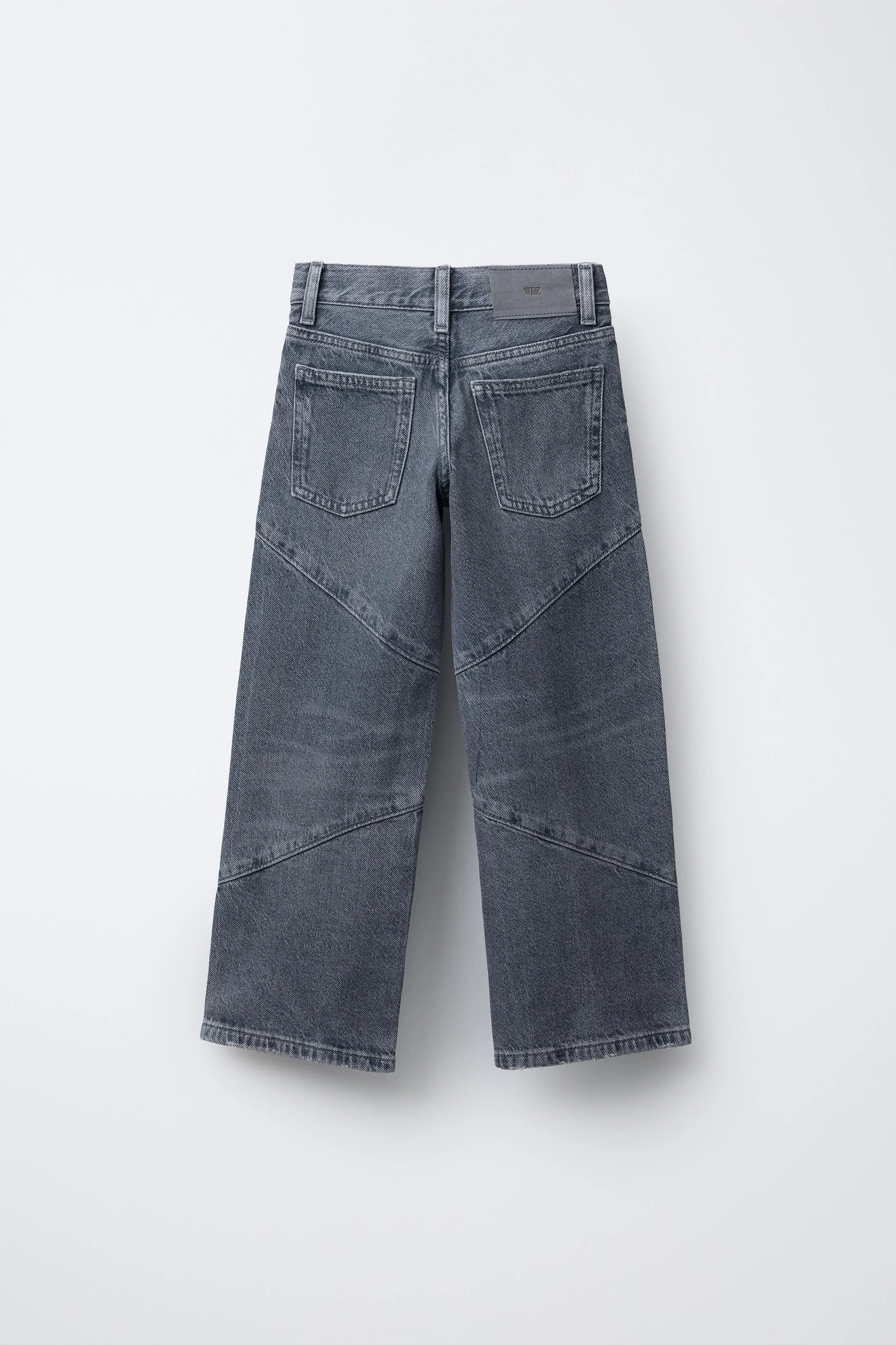 شلوار جین پا گشاد با تزئینات پرچ