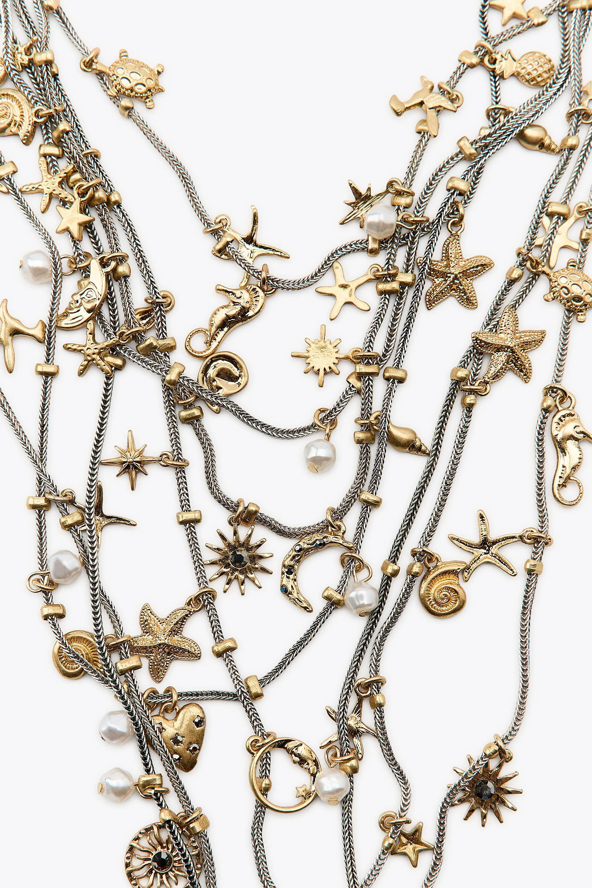 گردنبند چند رشته فلزی با آویزهای دریایی