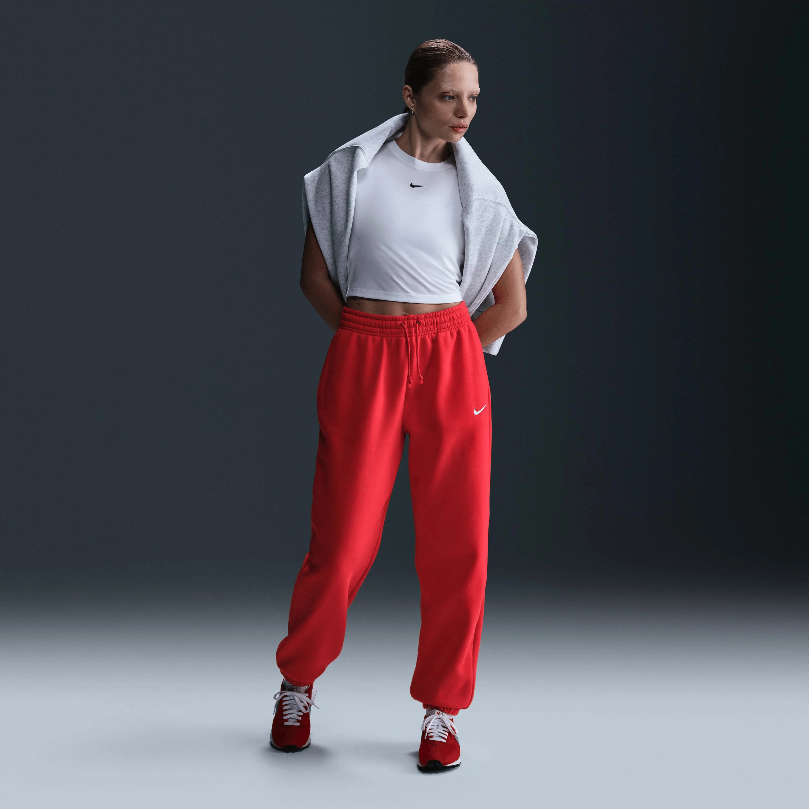 شلوار ورزشی زنانه نایک Sportswear Phoenix Fleece با کمر بلند و سایز بزرگ - قرمز یونیورسیتی/ بادبانی