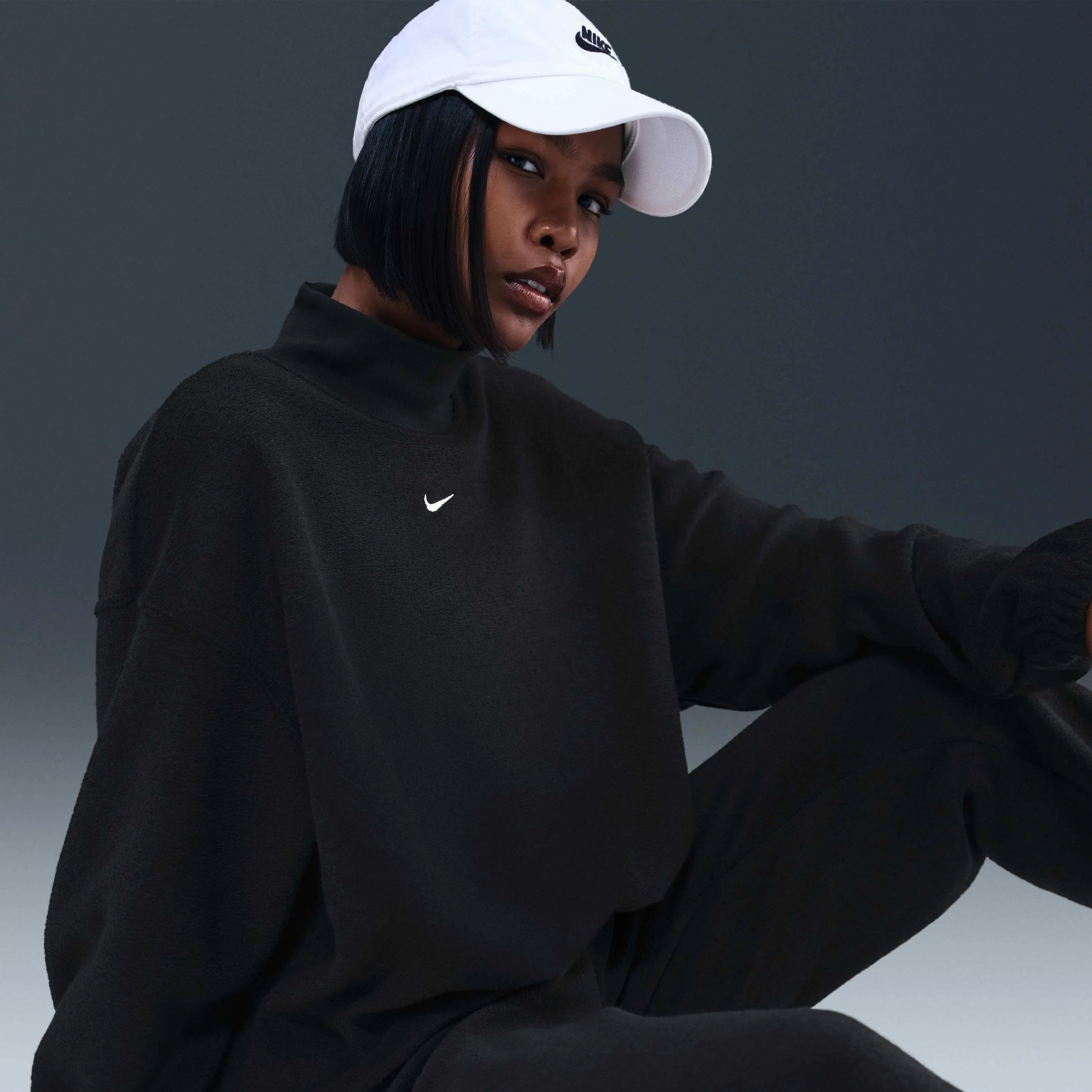 تاپ پشمی زنانه نایکی اسپرتس ویر فونیکس پلااش با یقه اسکی و سایز بزرگ