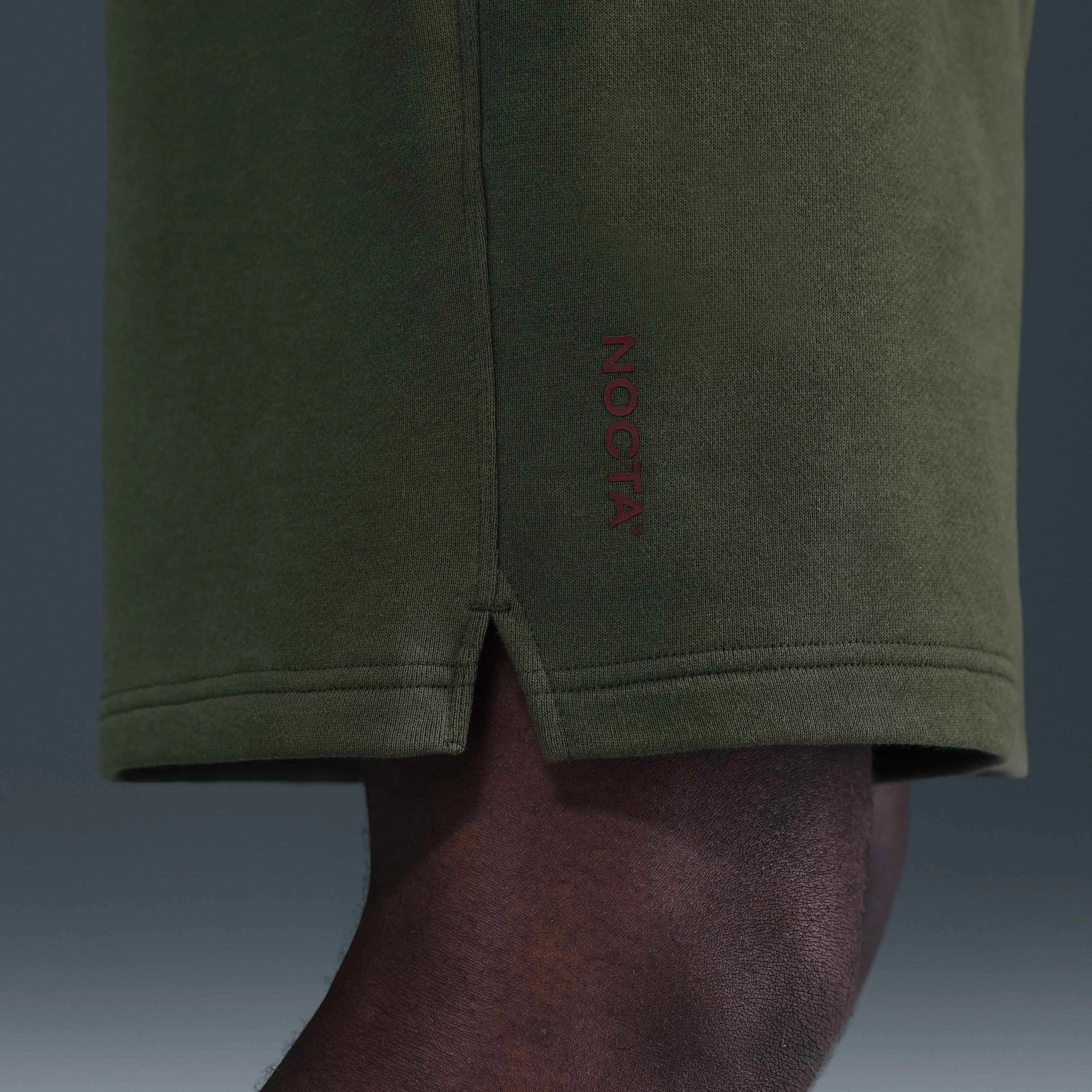 شلوارک پشمی نایک NOCTA Cardinal - خاکی/قرمز تیمی