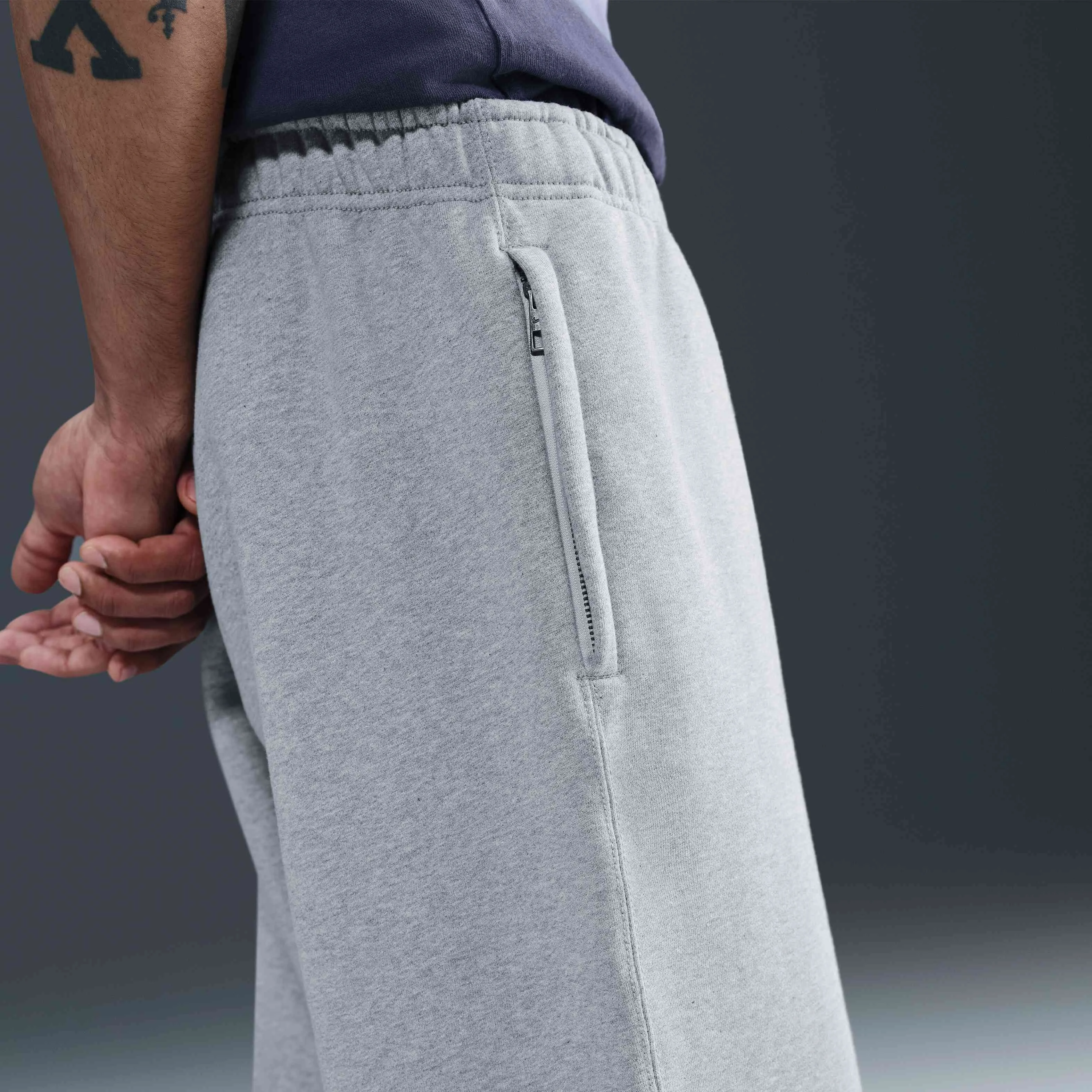 شلوار مردانه پشمی نایک مدل Solo Swoosh با لبه باز